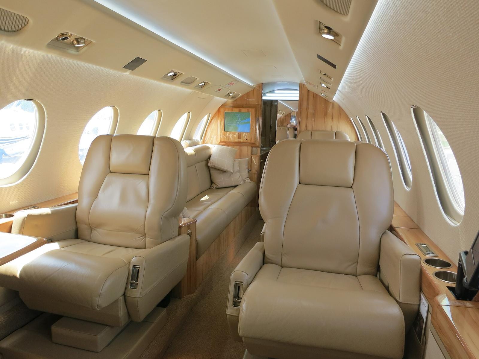 Business jet all beige interior. Wikimedia