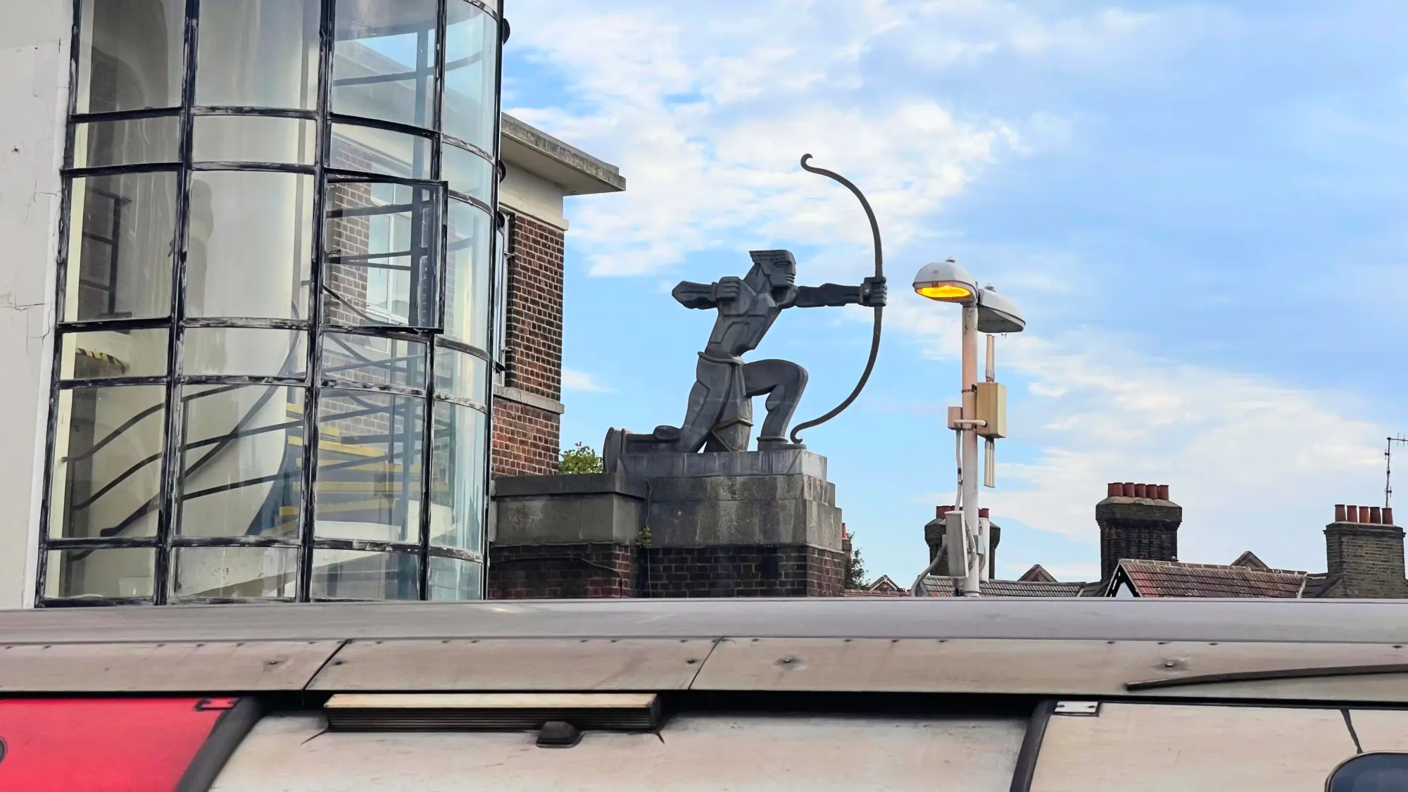 The locally famous sculpture of The Archer at East Finchley, showing cylindrical station windows