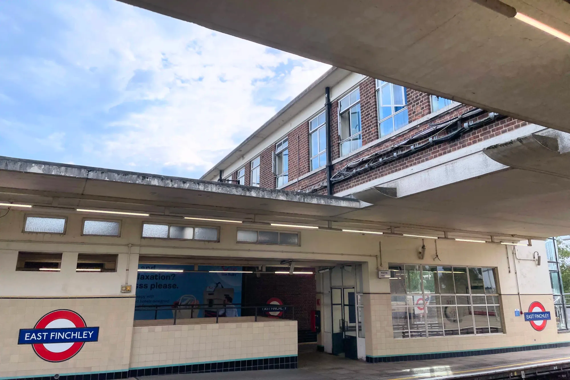 The walkway above the platforms is for exclusive staff use - the subway underneath is for passengers