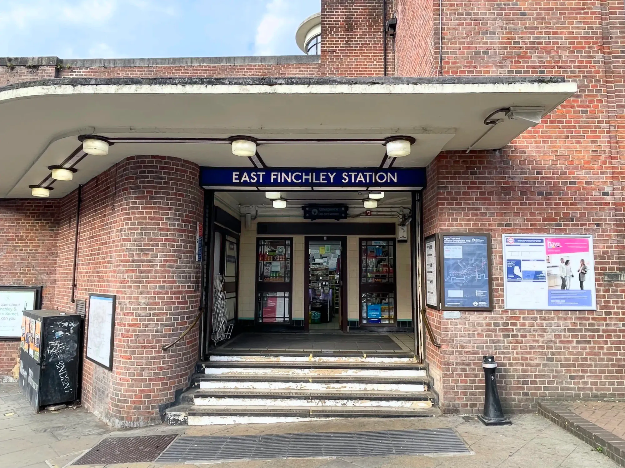 The brick station entrance on The High Road