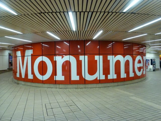 Monument station,  Calvert font on circular mezzanine feature. CC Chris Downer