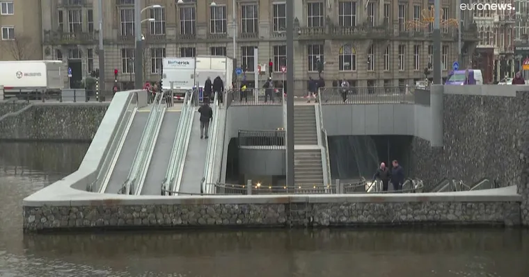 Stairs & escalators leading under water to Amsterdam's new underwater bike parking garage