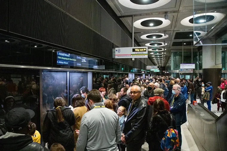 Crossrail crowded station platform, waiting for a train
