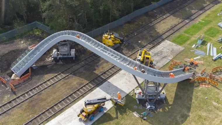 Aerial view of S shaped lifted & shifted Flow Bridge over a Network Rail line