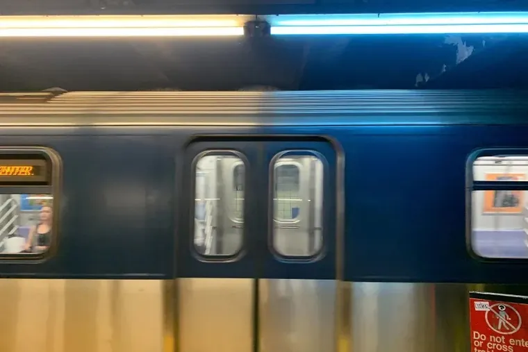 NYC Blue Lights on Subway platform shining on train