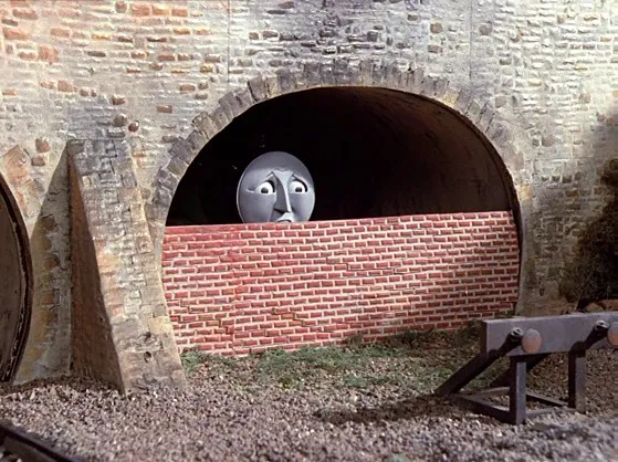 Sad Henry locomotive bricked up in a scene of Thomas the Tank Engine