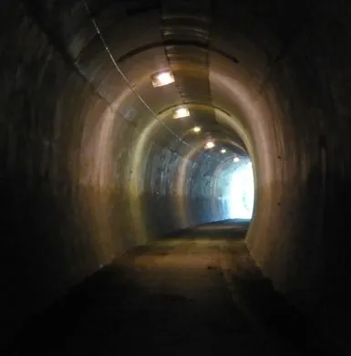 Interior of former railway Thurgoland Tunnel with curve, now a foot & bike path