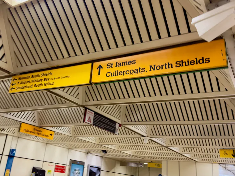 Monument Station's all yellow wayfinding signs: It is not clear at all how to get to the Green LIne Paul LF