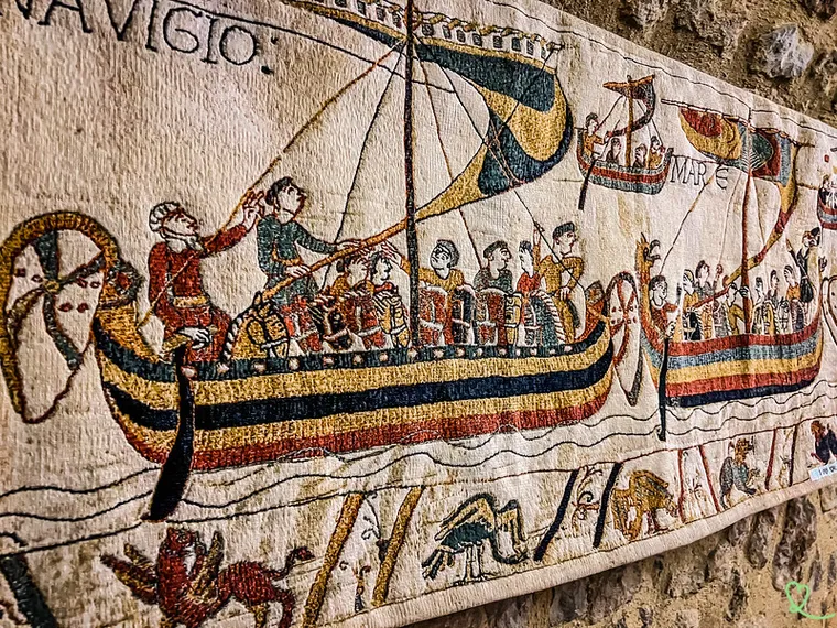 Bayeux Tapestry, close up of ships crossing La Tamis, returns to England for a year. Bayeux_musee_tapisserie