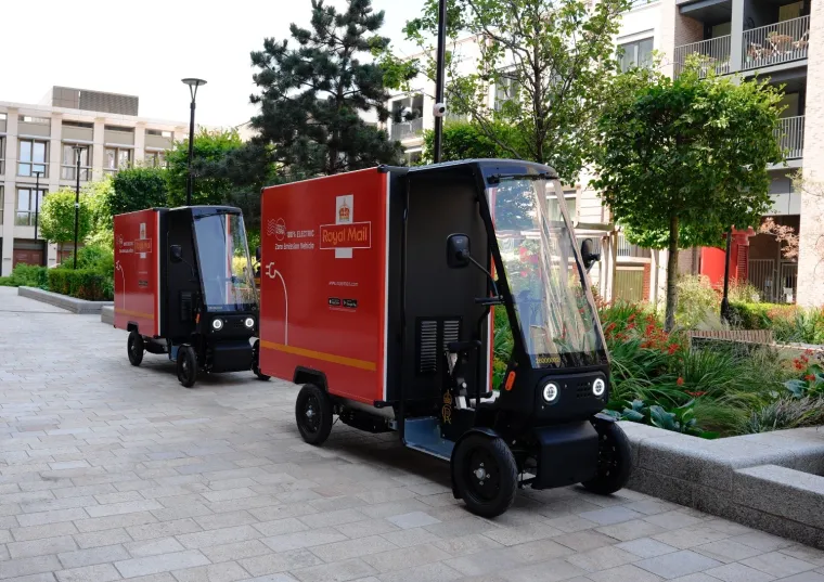 Smart looking red & black Royal Mail zero emission delivery buggies. Royal Mail