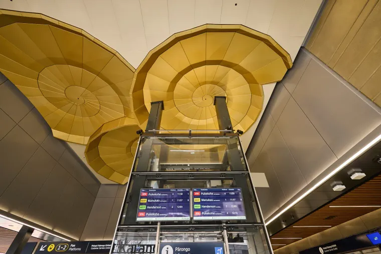 Karanga-a-Hape Station looking up shell ceiling art & destination screens. Auckland Transport